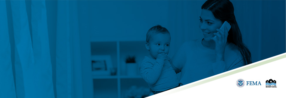 mother holding her child in her arm with other arm holding cellphone to her ear