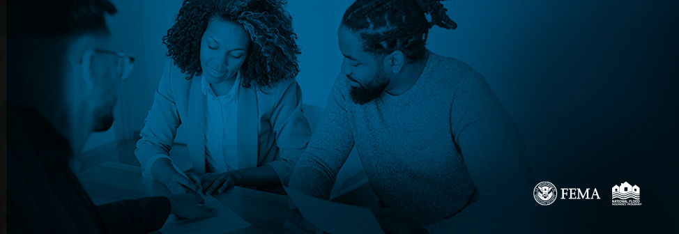 agent reviewing documents with client