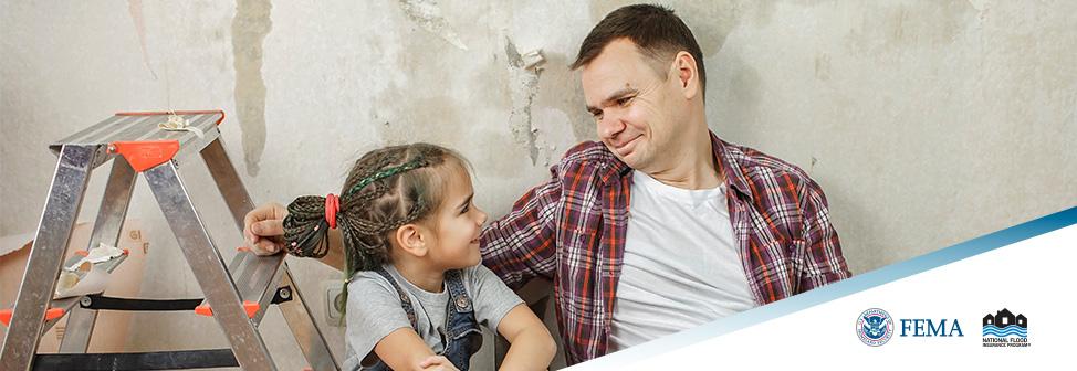 Man smiling down at daughter