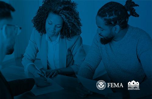 agent reviewing documents with client