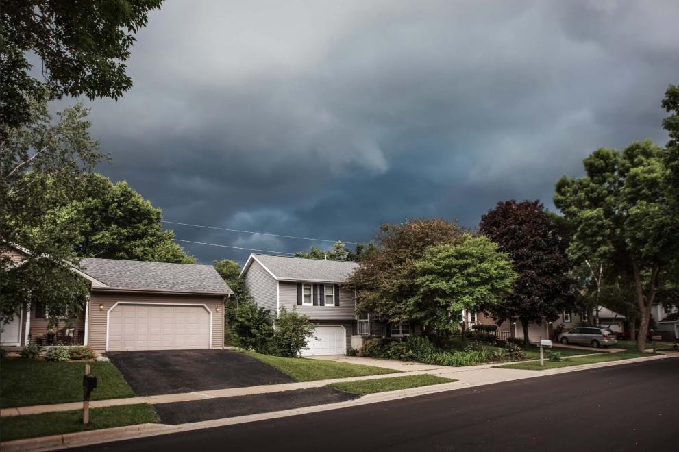 Residential street, storm brewing overhead