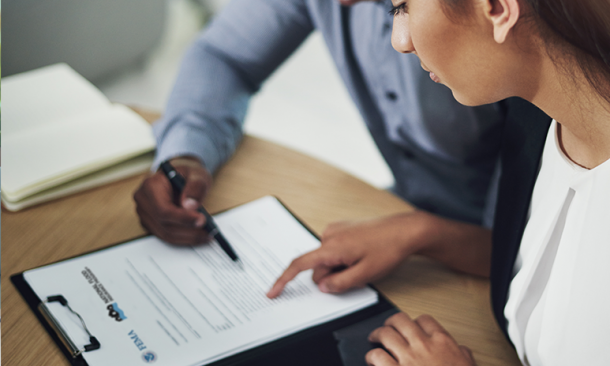 Agent reviewing forms with client
