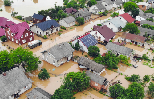 Aerial view of flooded dense residential neighborhood