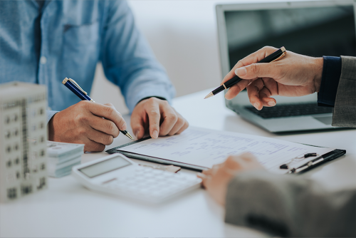 Insurance agent reviewing coverage and costs with client