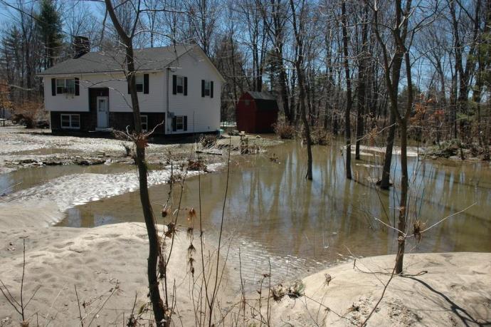 A home surrounded by flood water taken on 04/19/2007 in New Hampshire