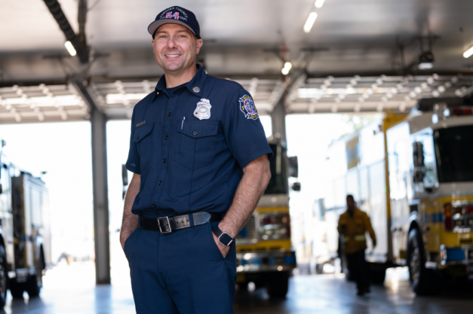 A picture of a person standing in a fire station
