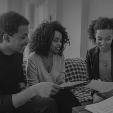 Family reviewing flood insurance paperwork