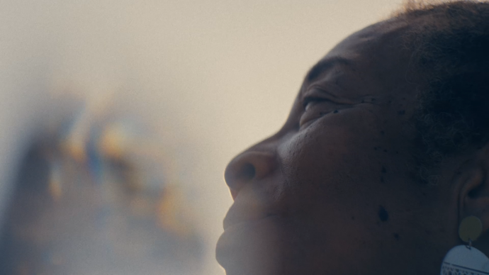 a person looks up at the sky