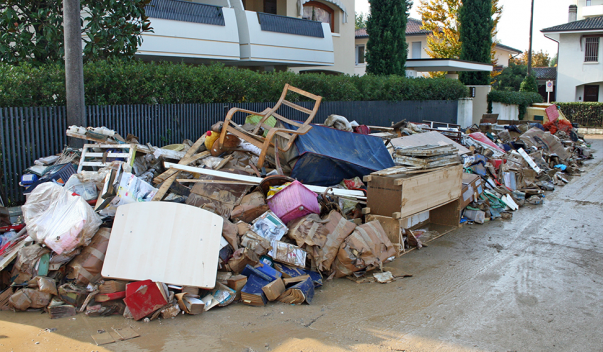 Flood debris piled up on side street