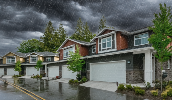 New rowhomes under storm clouds