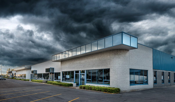 Commercial strip buildings under storm clouds